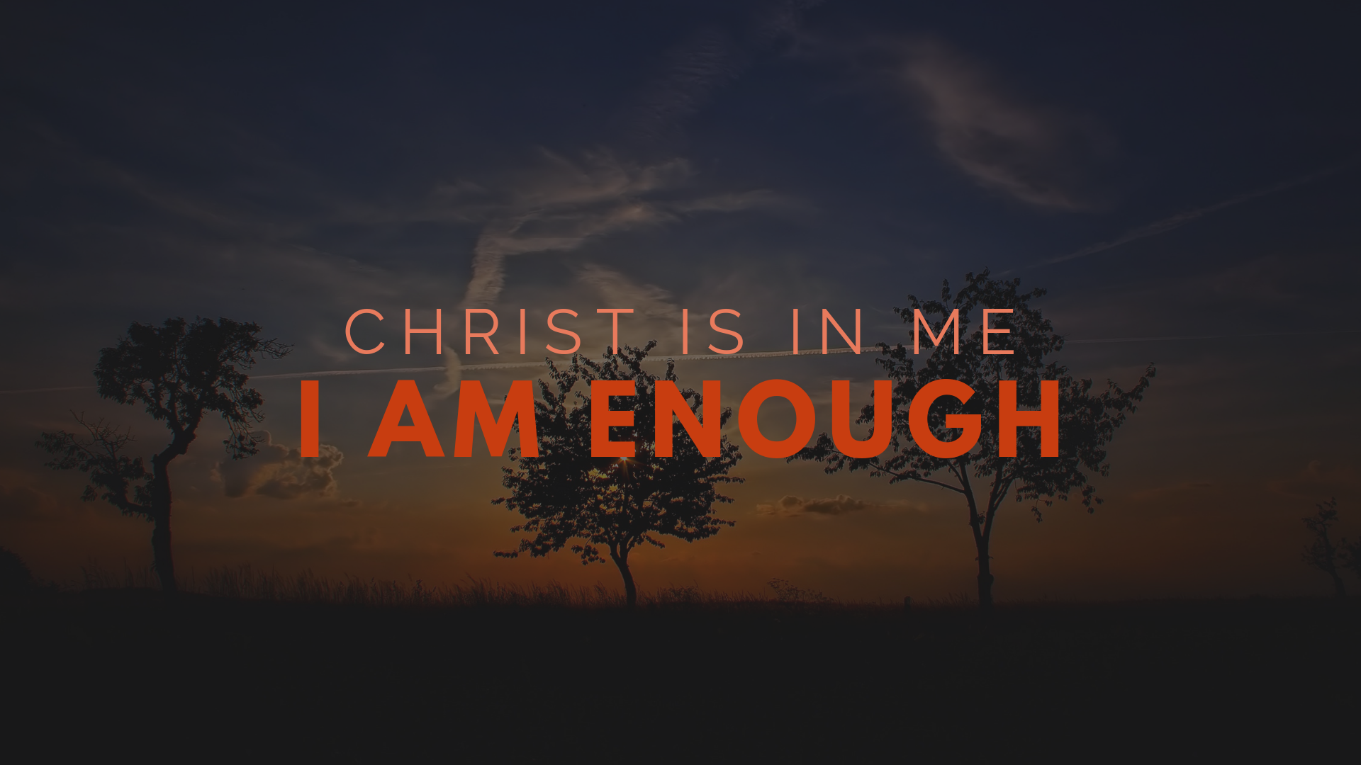 In bold red and coral lettering the text say "Christ is in me, I am Enough". In the darkened background three trees stand with the sun just setting. 